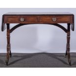 A George III style mahogany sofa table, rectangular top with drop leaves, rounded corners,