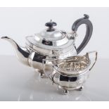 Silver three-piece teaset, ovoid form, beaded outlines, raised on four ball feet, by Mappin & Webb,