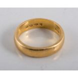 22 carat yellow gold 5.2mm wide wedding band, approximate weight 7.5gms, ring size O.