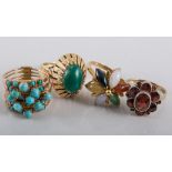 Four dress rings, a five row turquoise ring, an oval cabochon cut turquoise ring,