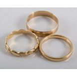 Three gold rings, a 9 carat yellow gold 4.