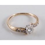 A diamond solitaire crossover ring,