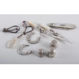 Two silver and mother of pearl 'trowel' page clips, three silver thimbles, three horseshoe tokens,