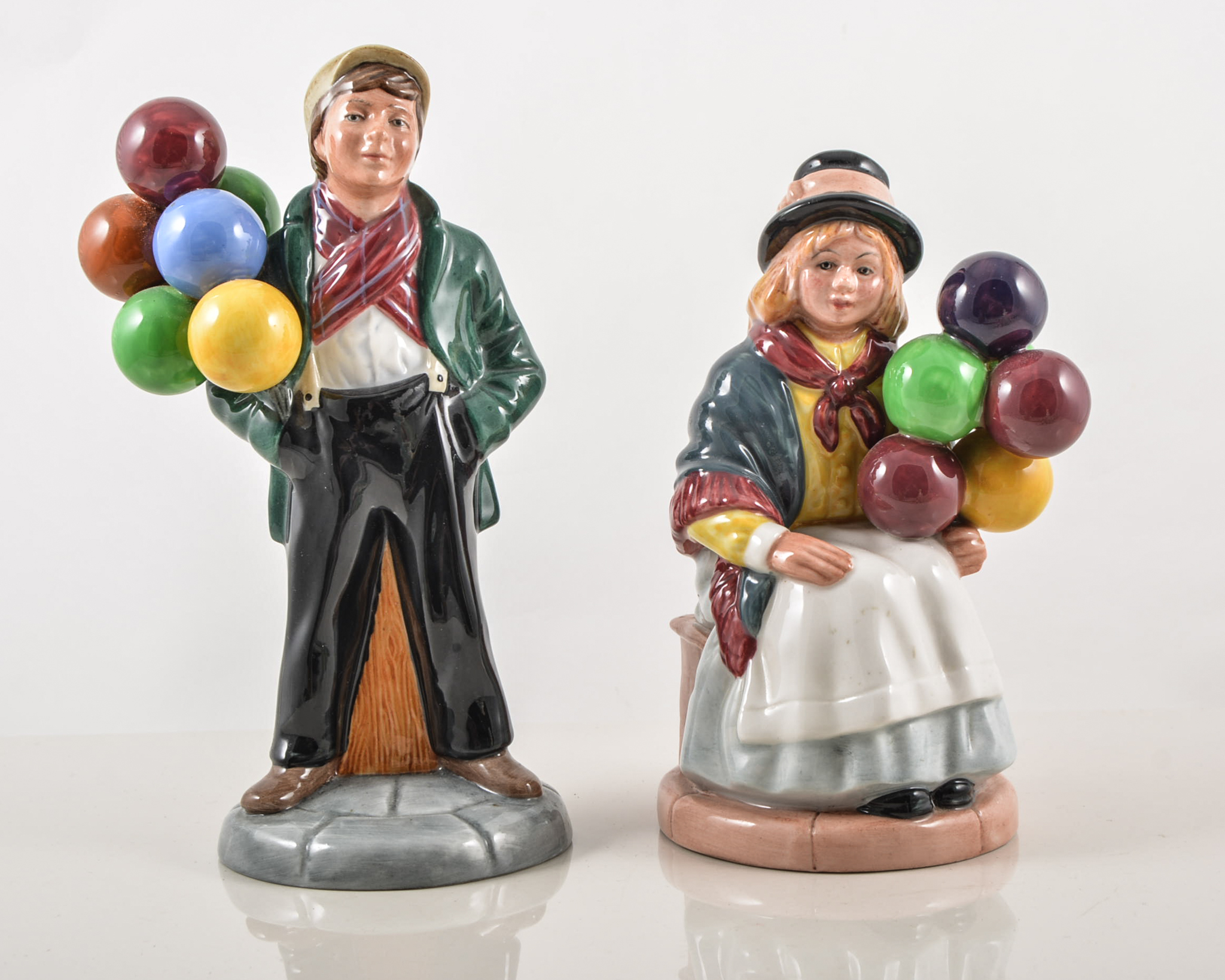 Two Royal Doulton Figurines, "Balloon Boy" number HN2934, "Balloon Girl" number HN2818.