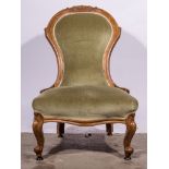 Victorian walnut framed nursing chair, spoon back with a carved shell and scroll cresting,