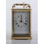 French brass cased carriage clock, beveled glass appertures, overall height 12cm.