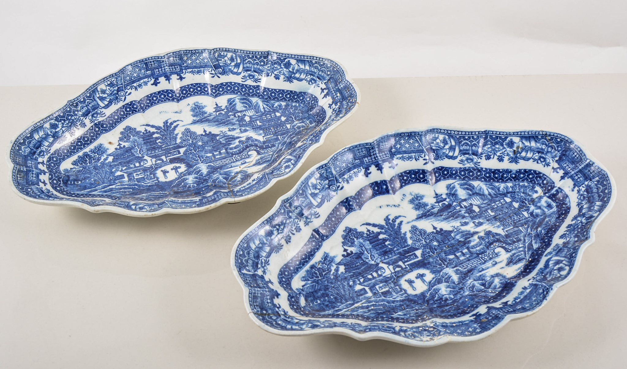 Two Caughley blue transfer printed dessert dishes, lozenge shape, 27cms, restored, (2).