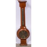 A reproduction walnut case aneroid wall barometer brass dial, signed Geo Tarratt, Leicester,