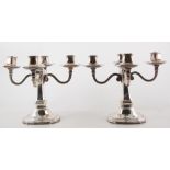 Pair of four branch plated candelabrum, large drip pans, 22cm high.