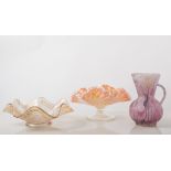 A collection of Carnival glass dishes in purple, green, marigold,