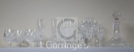 A Waterford cut crystal twenty six piece suite of drinking glasses and a ship's decanter with