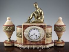 A French Art Deco ormolu and marble three piece clock garniture, the central architectural clock