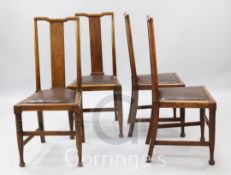 Four Arts & Crafts dining chairs, attributed to Voysey Workshop, with rectangular splat backs and