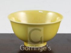 A Chinese yellow glazed small flared bowl, Kangxi six character mark and possibly of the period,