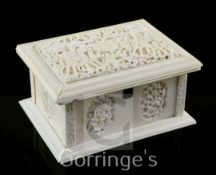 A Chinese export ivory casket, 19th century, with panels of figures amid pavilions and trees,