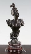 After Rene Charles Masse (French 1855-1913). A bronze bust of an elegant young lady, on red marble