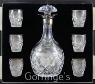 A Mappin & Webb silver mounted cut glass liqueur decanter and four tots, in fitted case
