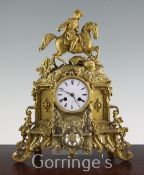 A 19th century French ormolu mantel clock, surmounted with a cavalier, the enamelled dial signed