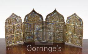 A 19th century Russian brass and champleve enamel four fold icon, each arched panel cast in relief