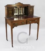 An Edwardian marquetry and rosewood bonheur du jour, with mirrored back and two drawers, W.3ft