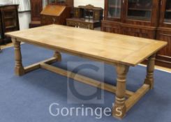 A large 17th century style oak refectory table, with H stretcher, 8ft x 3ft 11in.