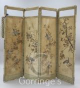 A Chinese four fold dressing screen with silvered threadwork panels, H.5ft 7in., damage