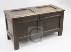 A small 17th / 18th century oak coffer, with twin panelled lid and front, W.3ft 2in.