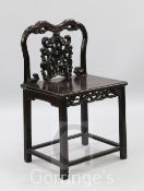 A Chinese hardwood chair, with carved and pierced back, H.2ft 11in.