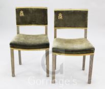 A pair of Elizabeth II limed oak coronation chairs, the velvet upholstered backs marked with ER