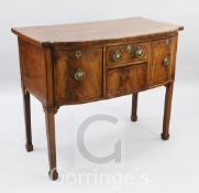 A small George III mahogany bowfront sideboard, fitted cupboard and three drawers, on squared