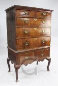 An early 18th century walnut and oak chest on stand, with two short and three long drawers over