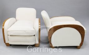 A pair of Art Deco burr walnut club armchairs, upholstered in pale cream leather