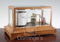 An Edwardian oak cased barograph, signed Munford, Tiverton, 14in.