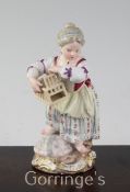 A Meissen figure of girl holding a birdcage, 19th century, incised model no.F23?, 11.5cm