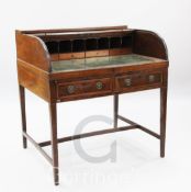 A George III mahogany roll top desk, with tambour over two frieze drawers, W.3ft