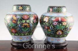 A pair of Chinese cloisonne enamelled jars and covers, 20th century, each decorated with butterflies