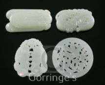 Four Chinese celadon jade plaques, carved as twin fish, a cicada, an archaistic chi-dragon and a