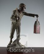 A late 19th century bronzed spelter table lamp, modelled as a tin miner, H.21in.