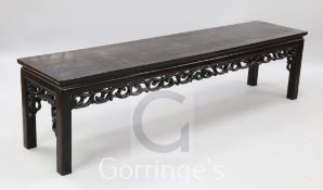 A Chinese hardwood low altar table, with scroll carved frieze, 6ft x 1ft 4in.