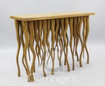 An unusual 20th century oak console table, trailing tendril base, 3ft 9in. x 1ft 5in.