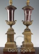 A pair of gilt metal and rouge marble mounted table lamps, in the neo-classical style, height to