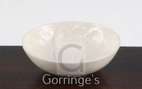 A Chinese Ding type flower moulded shallow bowl, 9.4cm