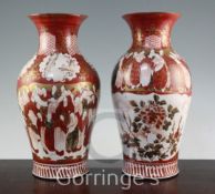 A pair of Japanese Kutani baluster vases, each painted with rakan and peonies on a gilt decorated