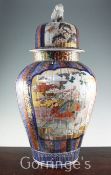 A large Japanese Imari fluted vase and cover, late 19th century, painted to each side with figures