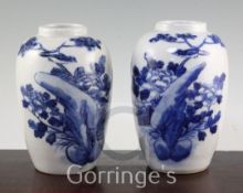 A pair of Chinese blue and white crackle glaze ovoid vases, early 20th century, each decorated