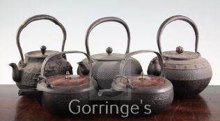 Five Japanese cast iron teapots, two with lacquer covers, 19th century, of varying form, largest