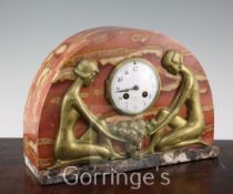 A French Art Deco rouge marble and bronze mantel clock, with circular arabic dial, 10in.