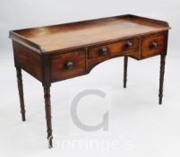 A Victorian mahogany side table, with three quarter gallery back above three frieze drawers on