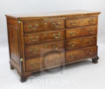 A mid 18th century oak mule chest, fitted four dummy and four long drawers, with quarter column