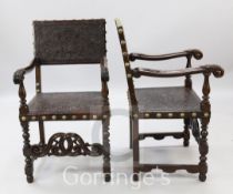 A pair of 17th century Spanish style stained and carved beech elbow chairs, with embossed leather